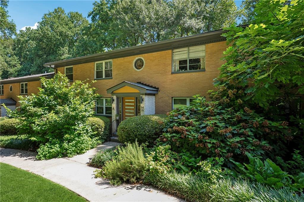 1010 Scott Boulevard, Unit A6 Decatur, GA 30030 - Photo 20 of 26 a backyard of a house with large trees and plants