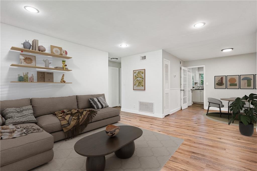 1010 Scott Boulevard, Unit A6 Decatur, GA 30030 - Photo 2 of 26 a living room with furniture and wooden floor