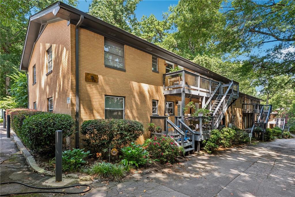 1010 Scott Boulevard, Unit A6 Decatur, GA 30030 - Photo 23 of 26 a front view of a house with garden