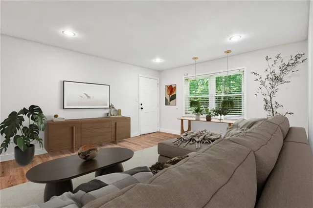 a living room with furniture and a large window