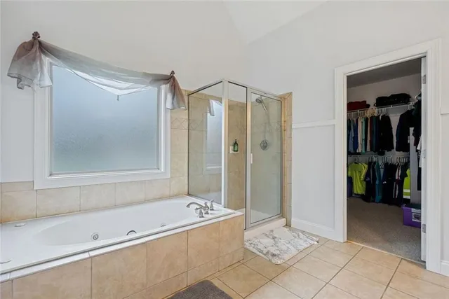 a bathroom with a tub and a shower