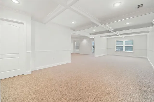 an empty room with a empty space and windows