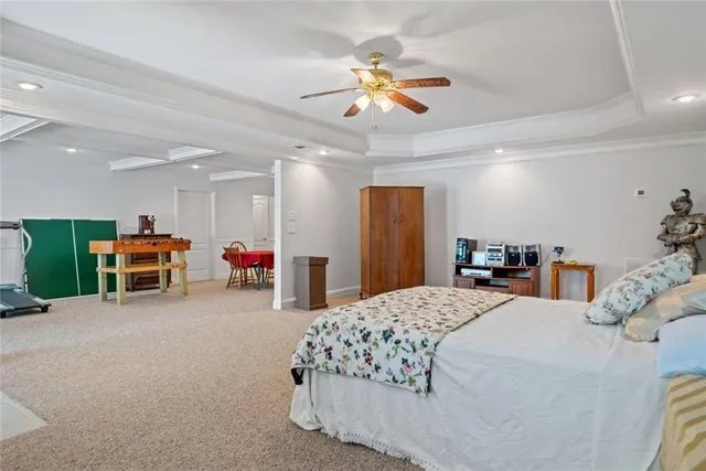 a bed room with bed and a chandelier