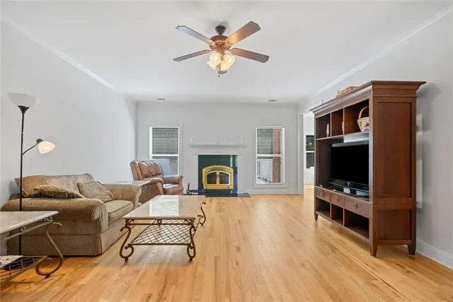 a living room with furniture fireplace and flat screen tv