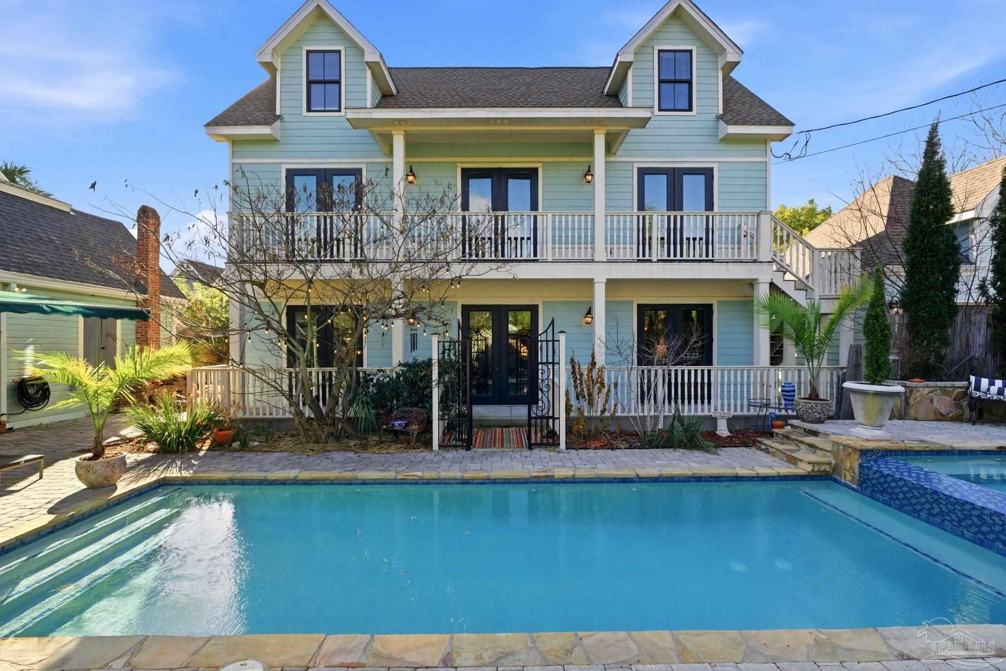714 East La Rua Street Pensacola, FL 32501 - Photo 42 of 63 a front view of a house with swimming pool