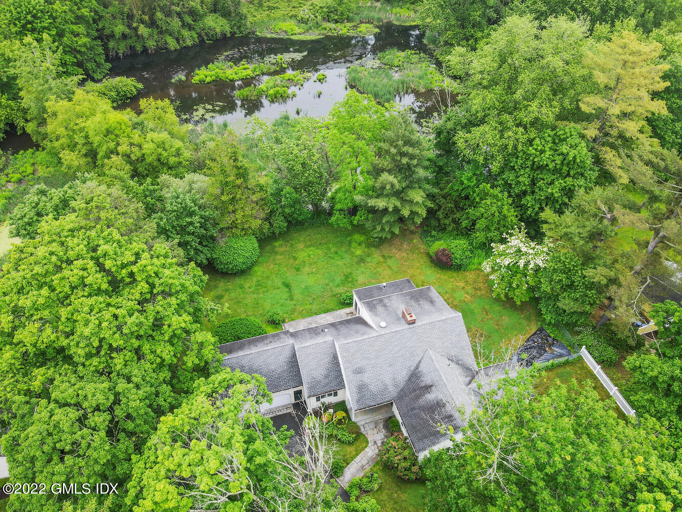 75 Fairfield Road Greenwich, CT 06830 - Photo 2 of 18 an aerial view of a house with yard and outdoor seating