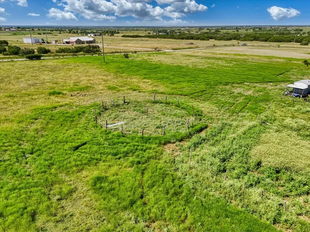 a view of a large body of water with a building in the background