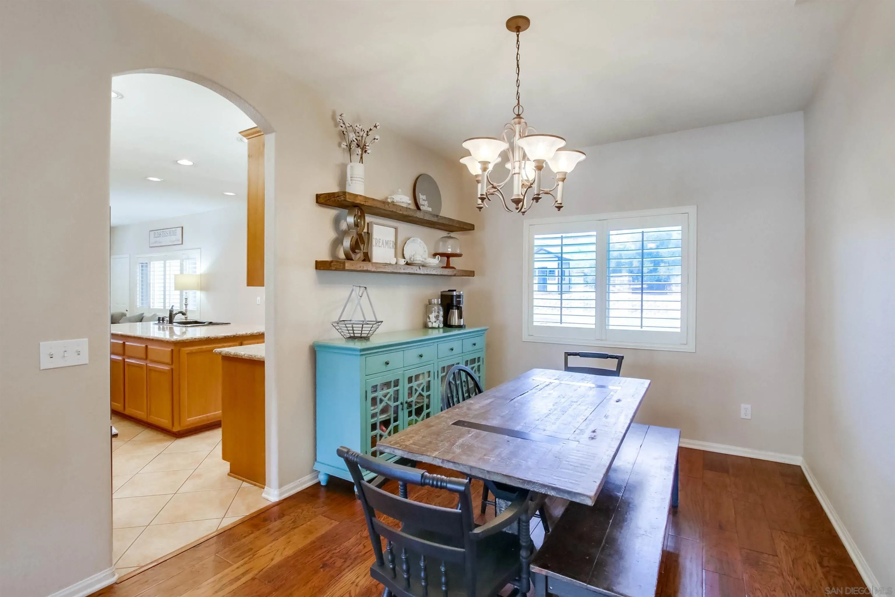 16304 Dartolo Road Ramona, CA 92065 - Photo 11 of 64 a view of a dining room with furniture window and wooden floor
