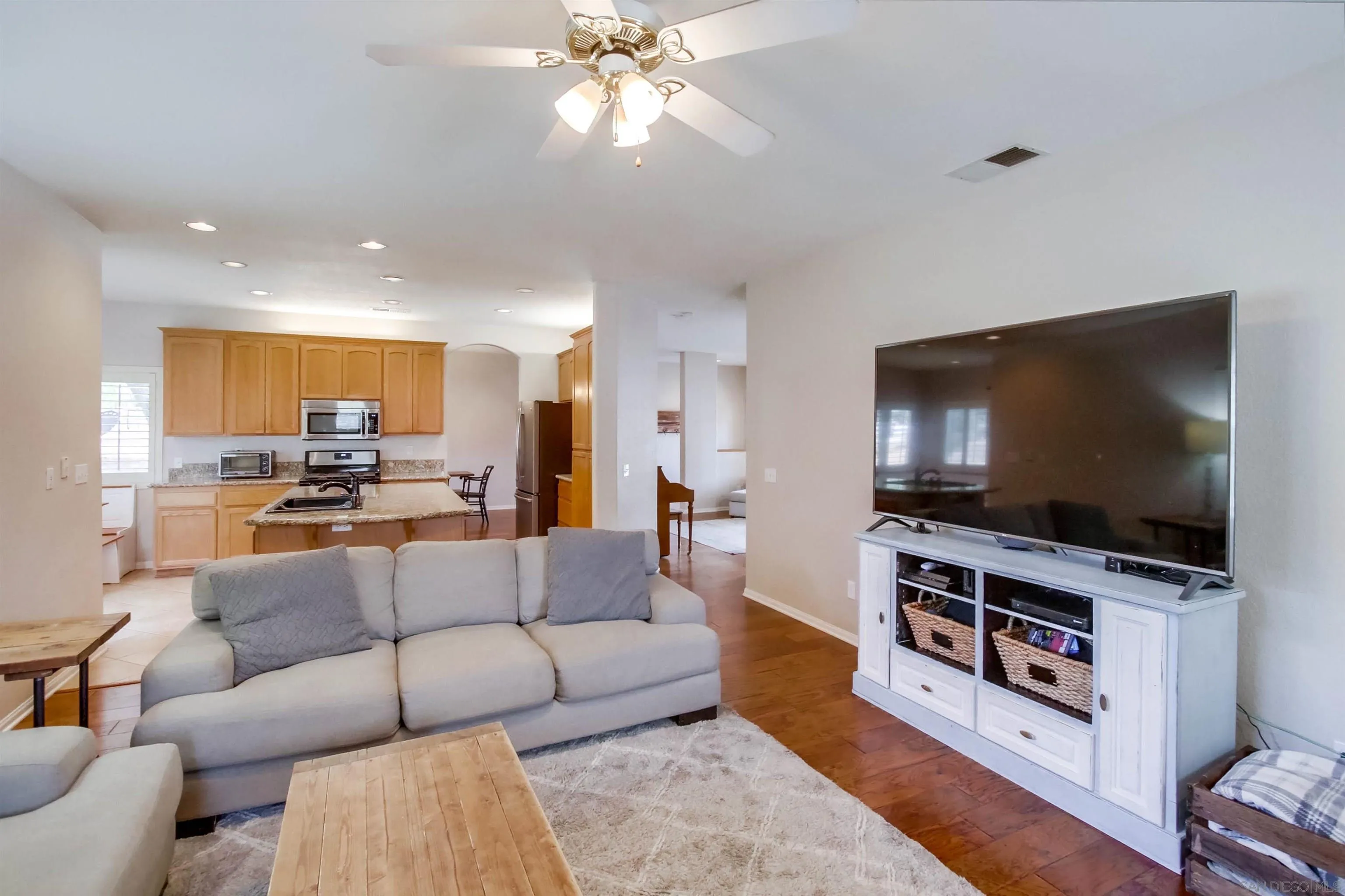 16304 Dartolo Road Ramona, CA 92065 - Photo 16 of 64 a living room with furniture and a flat screen tv