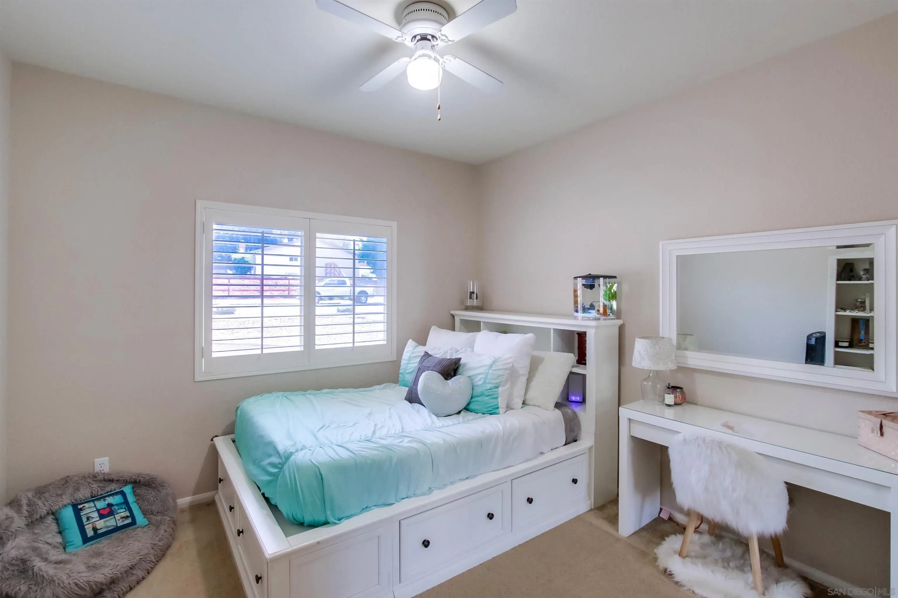 16304 Dartolo Road Ramona, CA 92065 - Photo 24 of 64 a bedroom with a bed and a chandelier