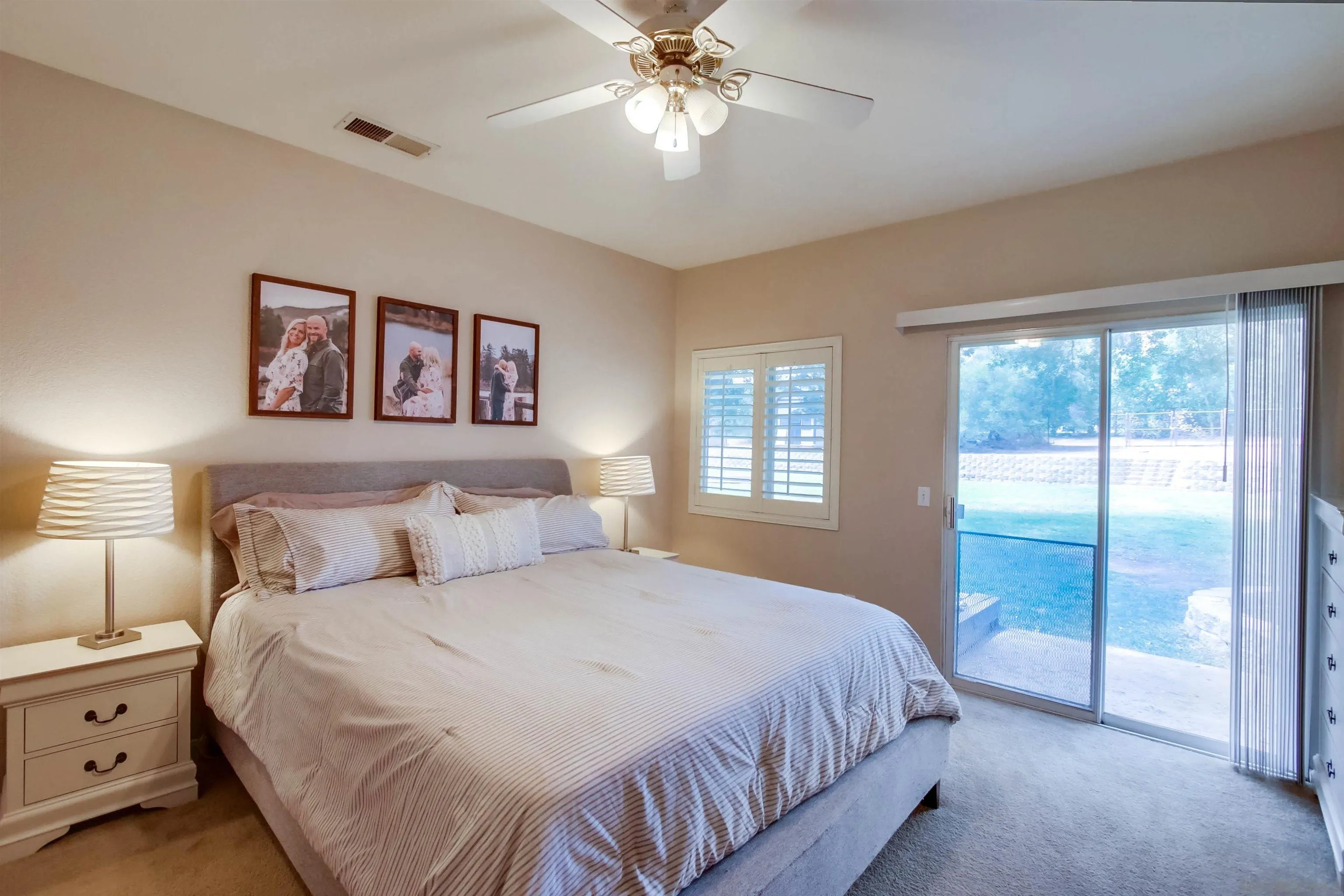 16304 Dartolo Road Ramona, CA 92065 - Photo 30 of 64 a bedroom with a large bed and a window