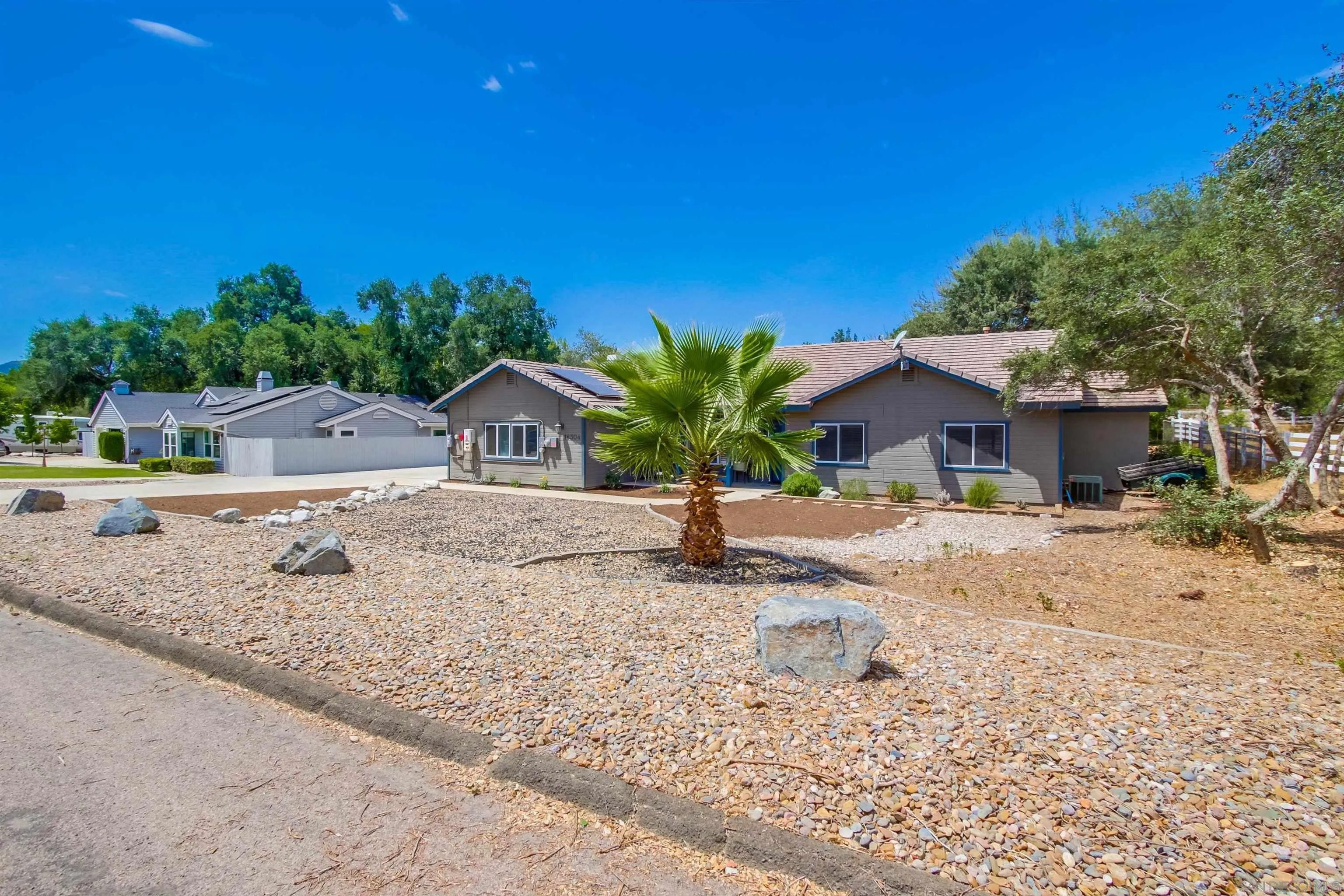 16304 Dartolo Road Ramona, CA 92065 - Photo 3 of 64 a house with a yard
