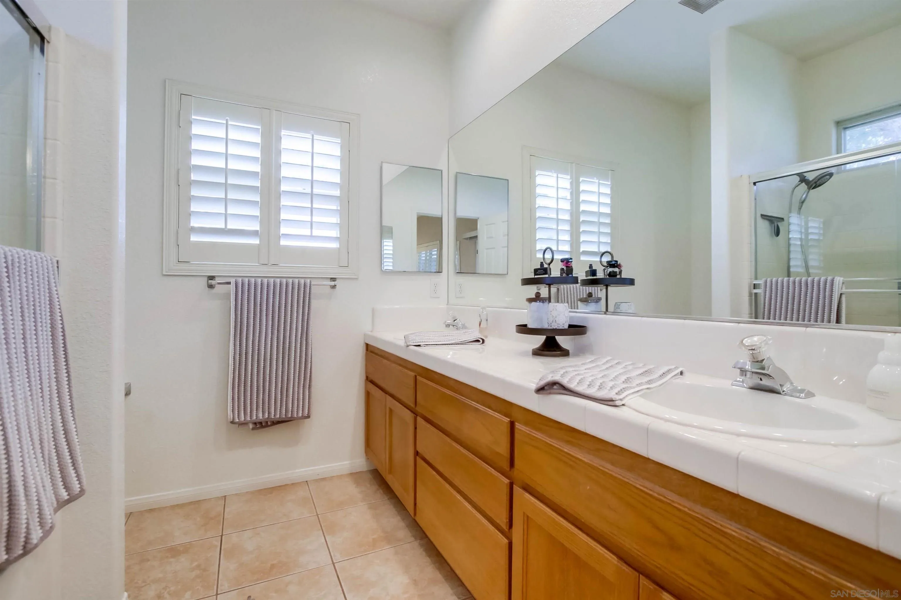 16304 Dartolo Road Ramona, CA 92065 - Photo 34 of 64 a bathroom with a sink and a mirror