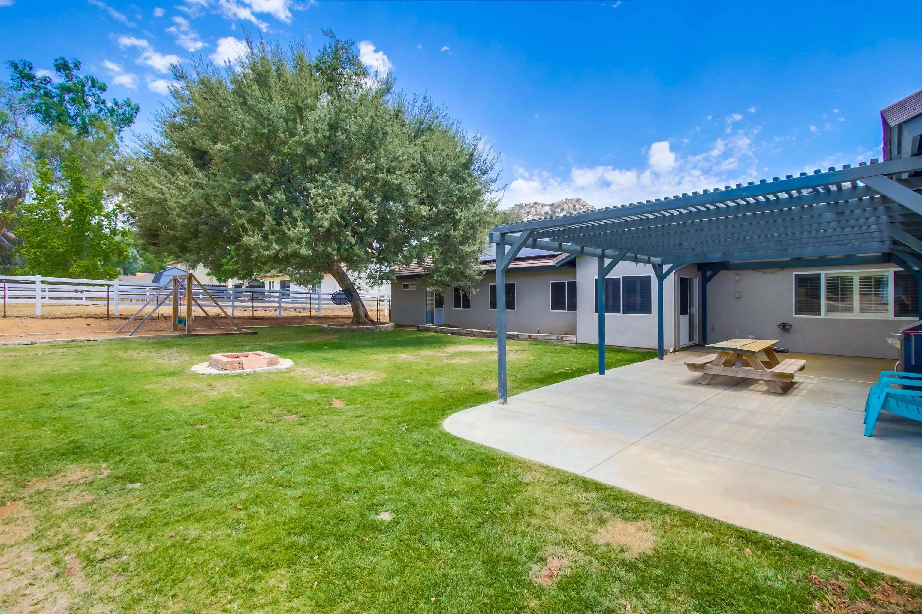 16304 Dartolo Road Ramona, CA 92065 - Photo 41 of 64 a view of a house with swimming pool and sitting area