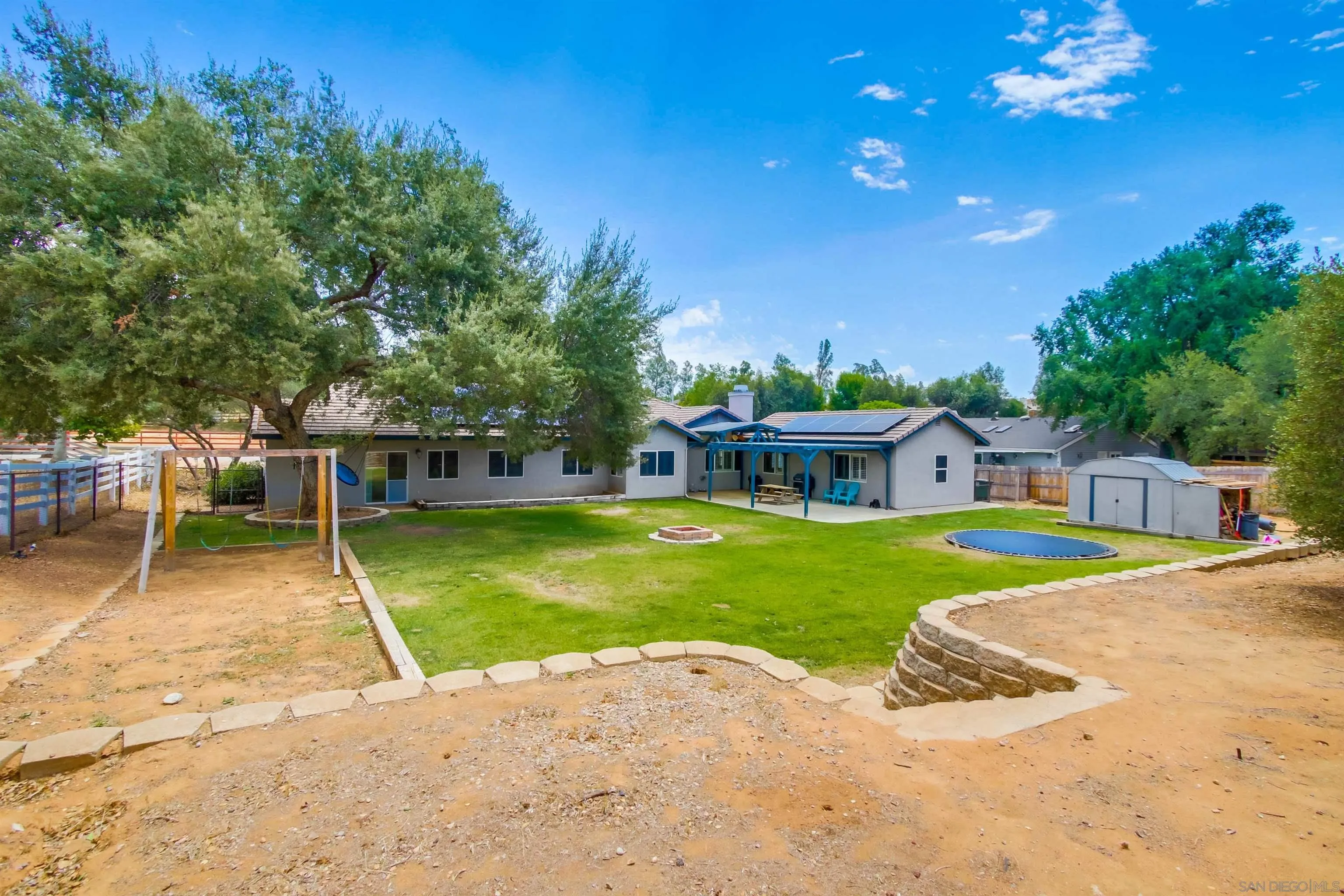 16304 Dartolo Road Ramona, CA 92065 - Photo 44 of 64 a view of a house with swimming pool