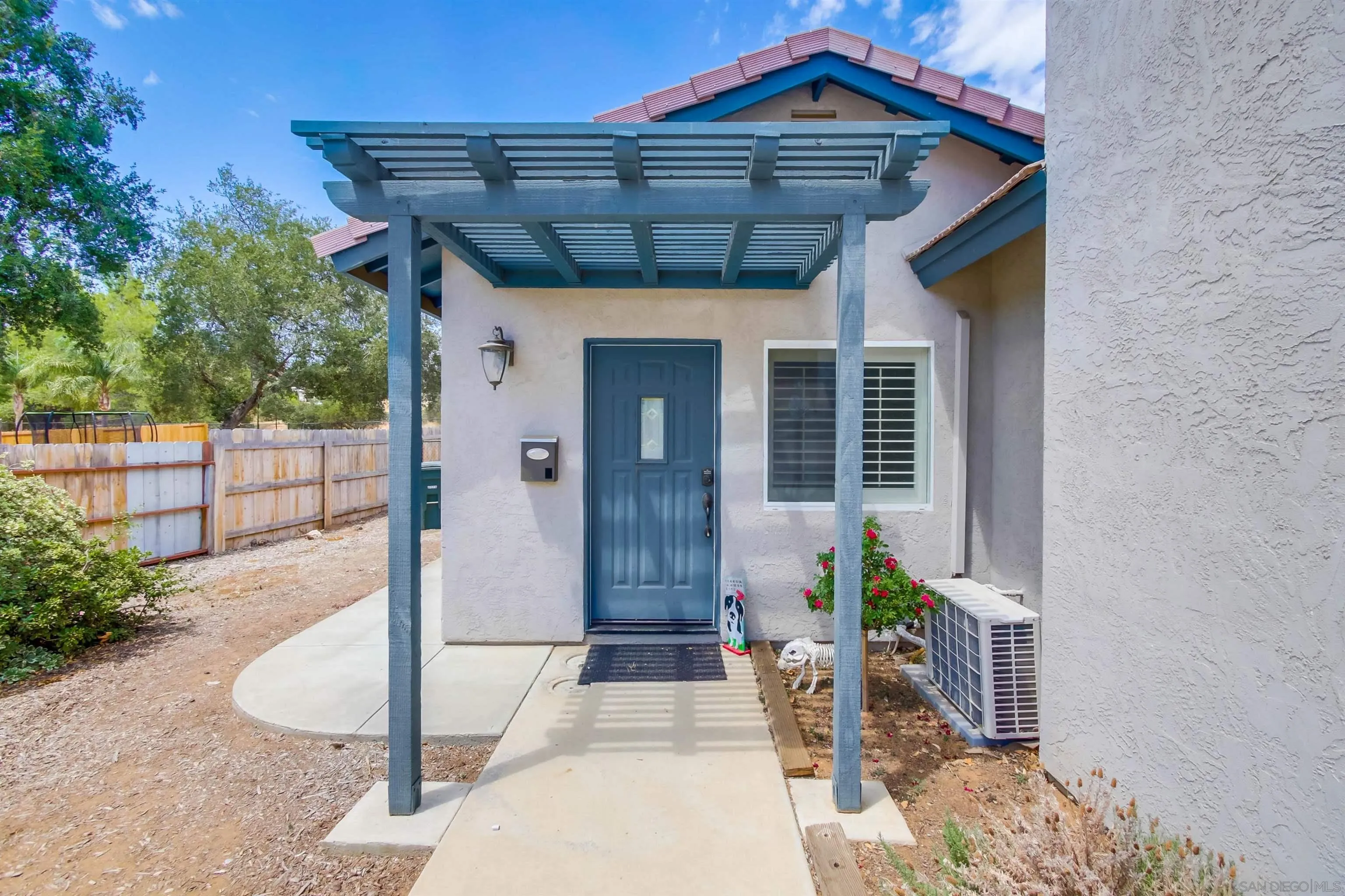 16304 Dartolo Road Ramona, CA 92065 - Photo 49 of 64 a front view of a house with a porch