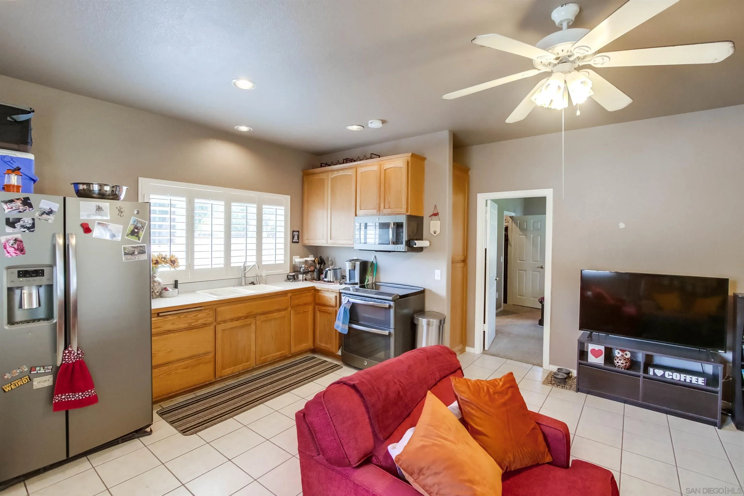 16304 Dartolo Road Ramona, CA 92065 - Photo 51 of 64 a living room with furniture and a flat screen tv