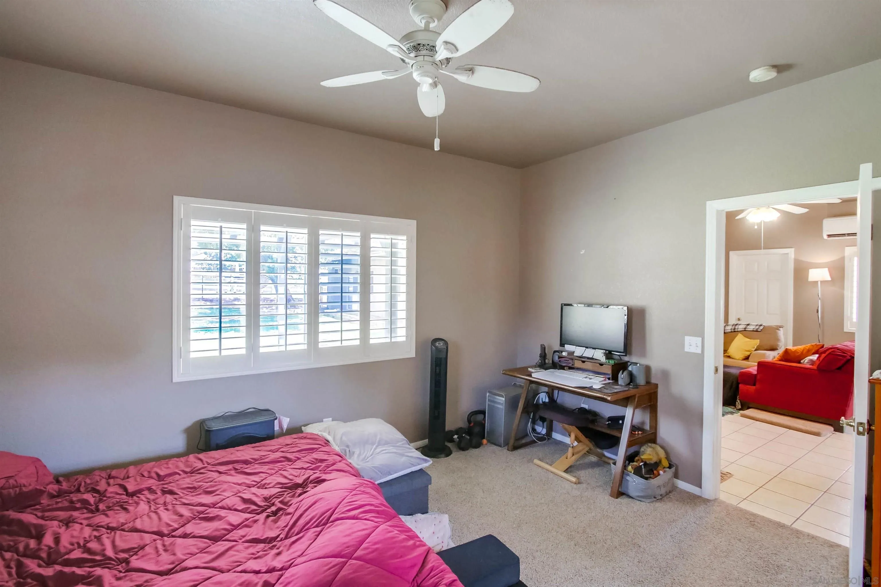 16304 Dartolo Road Ramona, CA 92065 - Photo 58 of 64 a bedroom with a bed and a window