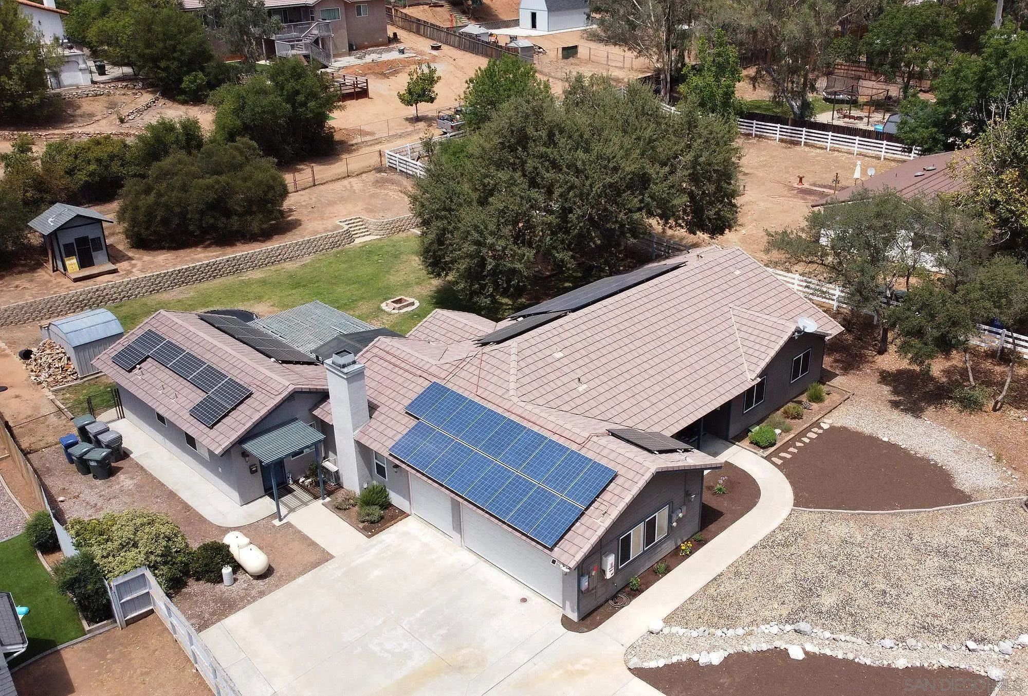 16304 Dartolo Road Ramona, CA 92065 - Photo 61 of 64 an aerial view of a house with swimming pool and a yard