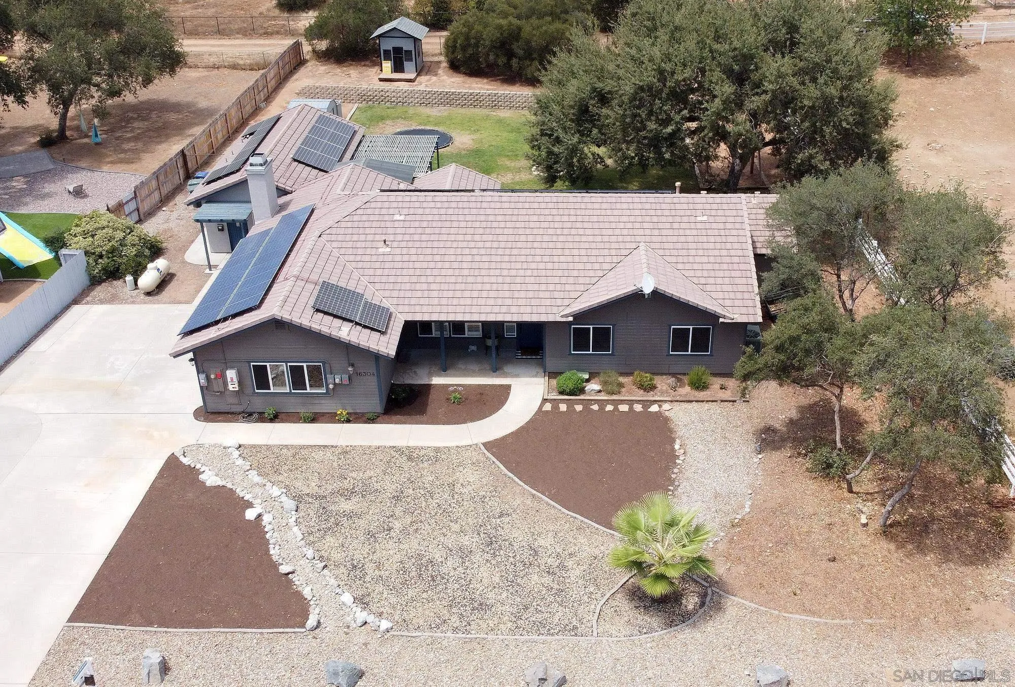 16304 Dartolo Road Ramona, CA 92065 - Photo 62 of 64 an aerial view of a house with yard and swimming pool