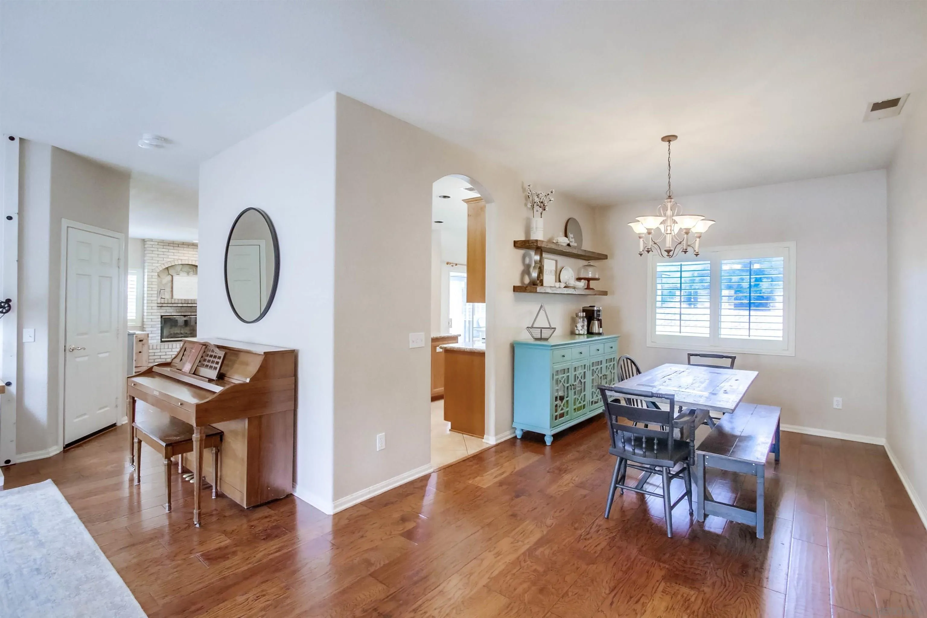16304 Dartolo Road Ramona, CA 92065 - Photo 10 of 64 a view of a dining room with furniture window and wooden floor