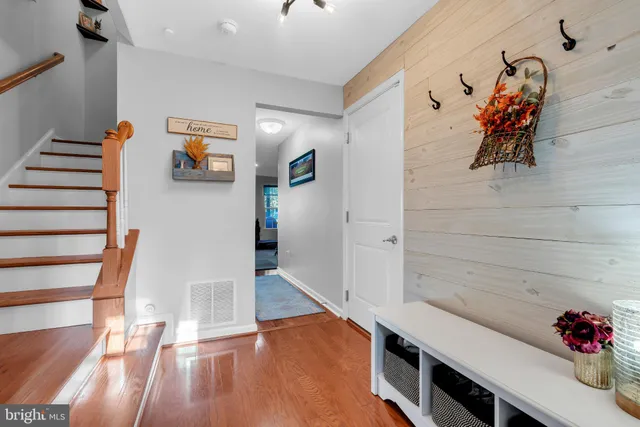 a view of entryway with stairs and toys