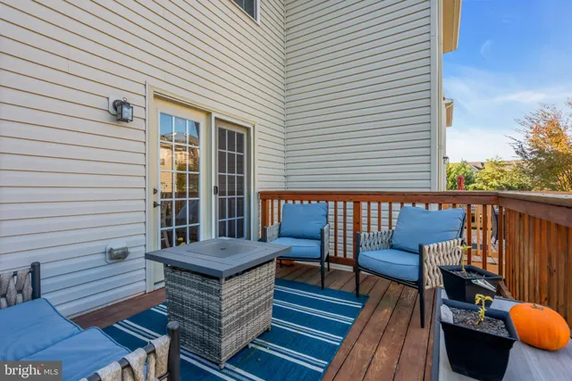 a view of a patio with wooden floor