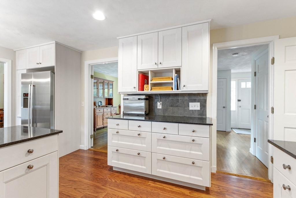 7 Countryside Road Natick, MA 01760 - Photo 11 of 37 a kitchen with stainless steel appliances a stove and a microwave