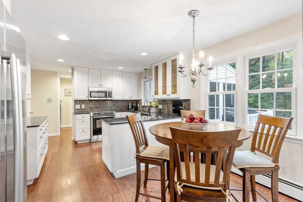 7 Countryside Road Natick, MA 01760 - Photo 12 of 37 a view of a dining room with furniture window and wooden floor