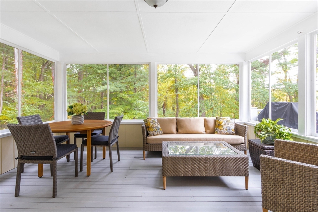 7 Countryside Road Natick, MA 01760 - Photo 15 of 37 a living room with furniture and floor to ceiling windows