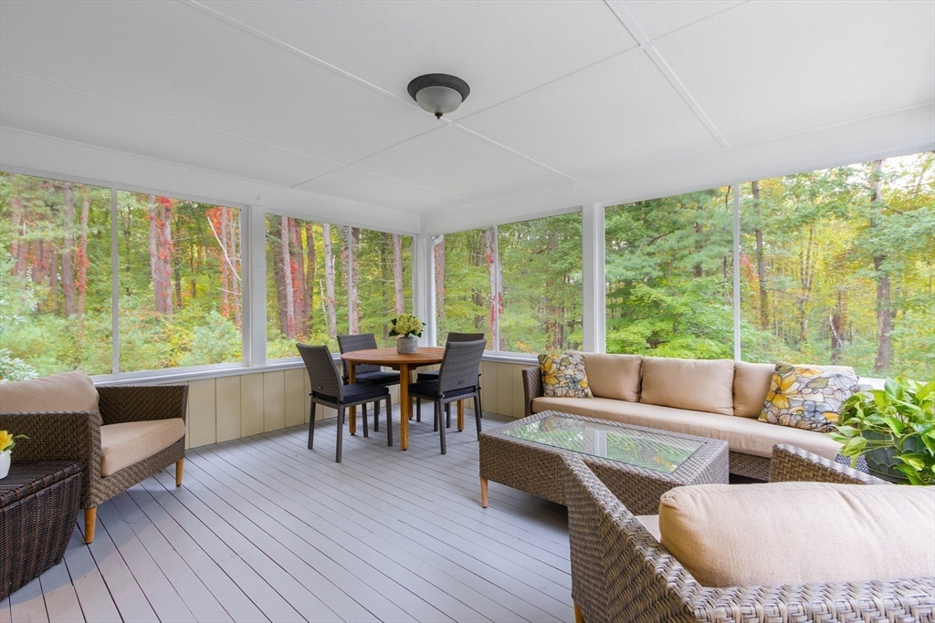 7 Countryside Road Natick, MA 01760 - Photo 16 of 37 a living room with furniture and a large window