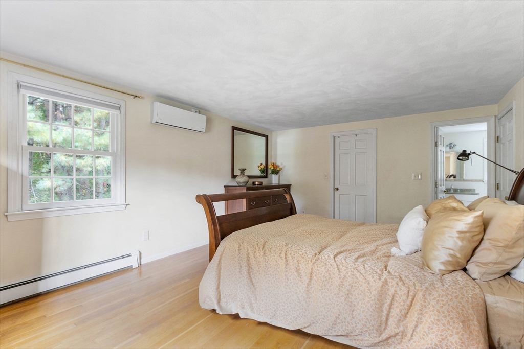 7 Countryside Road Natick, MA 01760 - Photo 20 of 37 a bedroom with a bed and a window