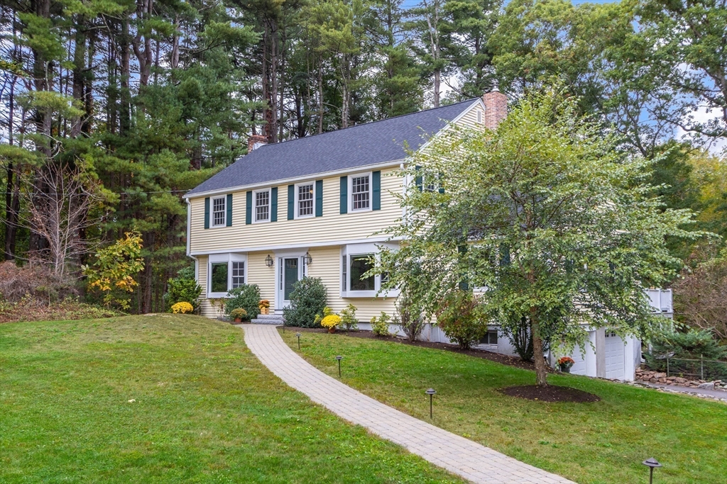 7 Countryside Road Natick, MA 01760 - Photo 2 of 37 a front view of a house with a yard