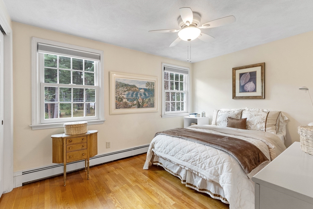 7 Countryside Road Natick, MA 01760 - Photo 22 of 37 a bedroom with a bed and a window with chair