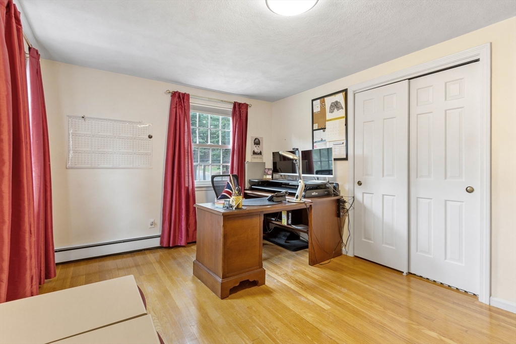 7 Countryside Road Natick, MA 01760 - Photo 23 of 37 a view of a workspace with furniture and a window
