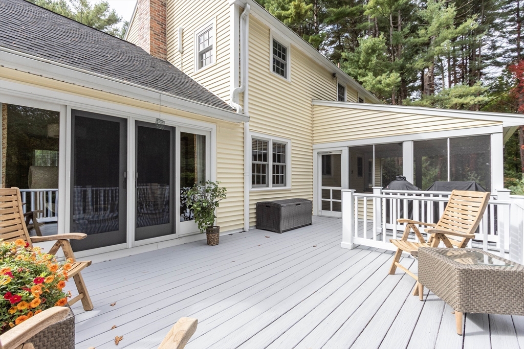 7 Countryside Road Natick, MA 01760 - Photo 28 of 37 a view of a house with a wooden deck