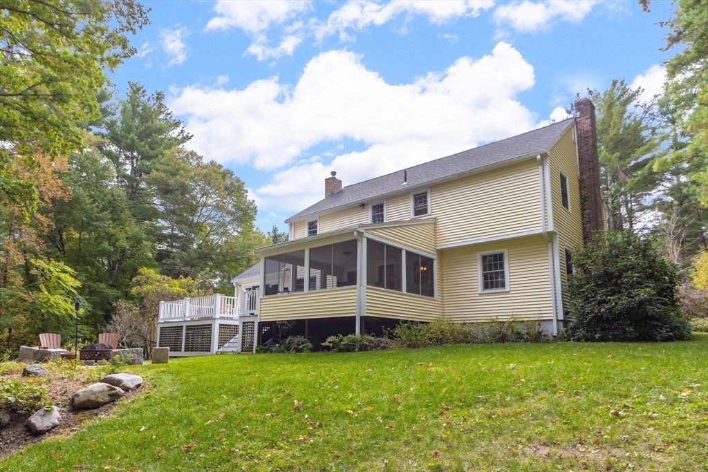 7 Countryside Road Natick, MA 01760 - Photo 31 of 37 a view of a house with a backyard