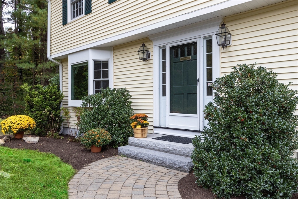 7 Countryside Road Natick, MA 01760 - Photo 37 of 37 a front view of a house with garden