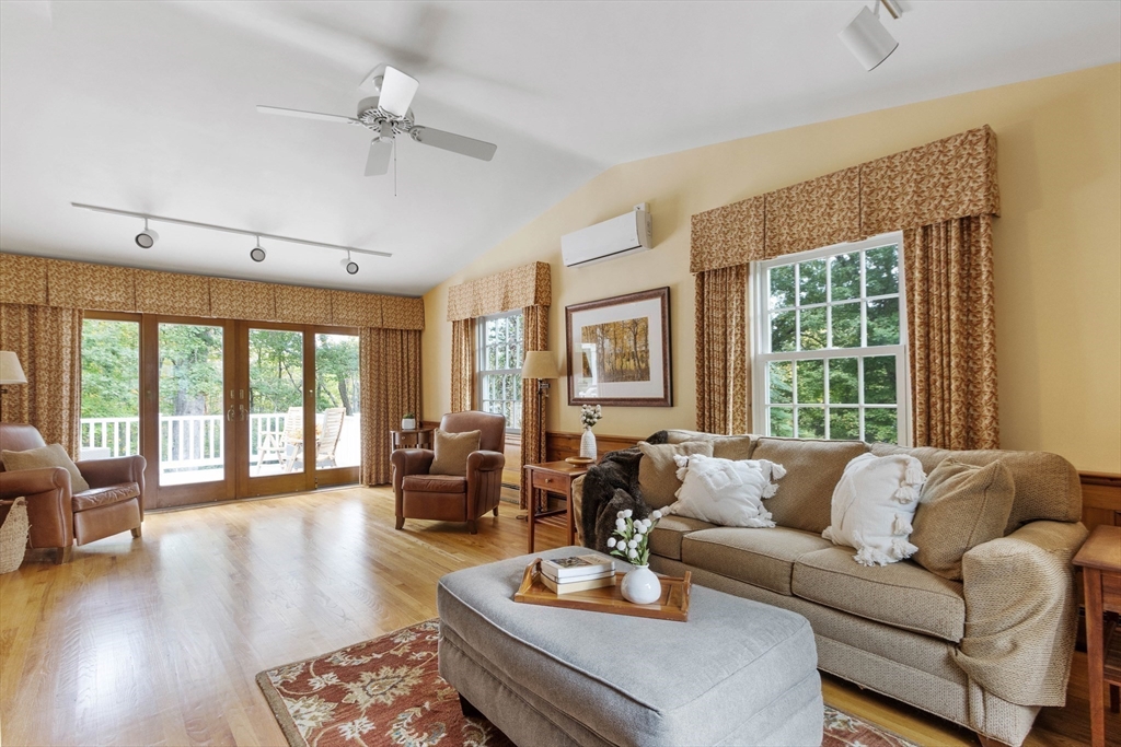 7 Countryside Road Natick, MA 01760 - Photo 5 of 37 a living room with furniture and a large window with wooden floor