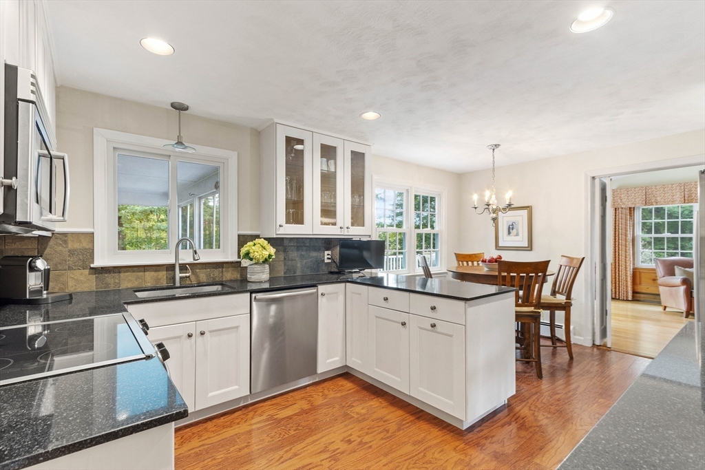 7 Countryside Road Natick, MA 01760 - Photo 9 of 37 a kitchen with granite countertop a sink and cabinets