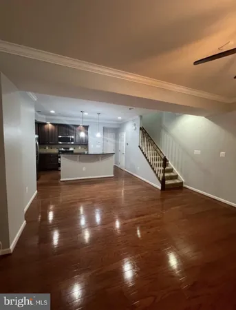 a view of a room with wooden floor