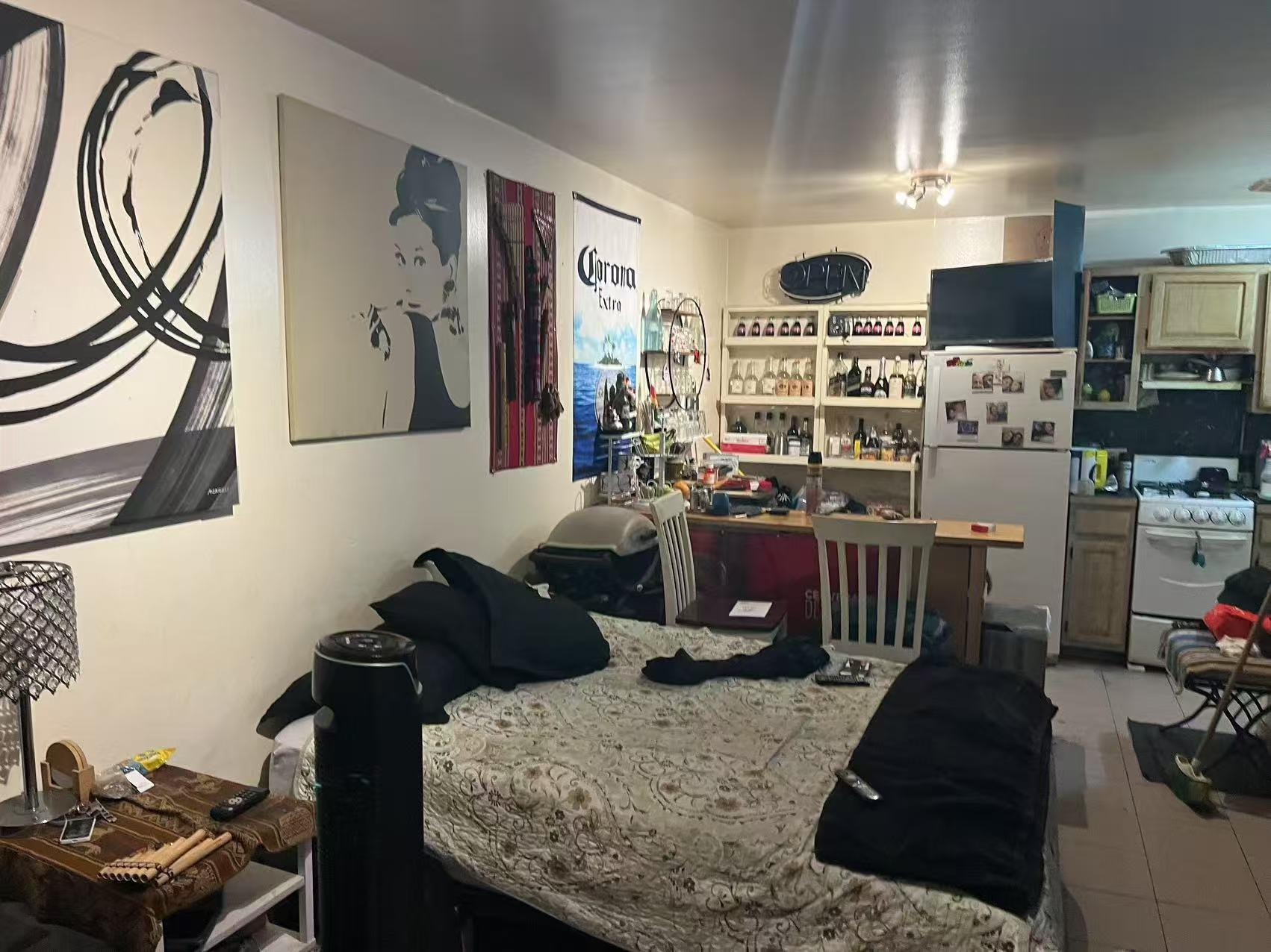 109-12 Westside Avenue Queens, NY 11368 - Photo 4 of 5 a living room with furniture fireplace and flat screen tv