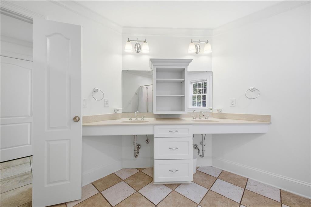 5 St Andrews Way Rome, GA 30165 - Photo 58 of 75 a bathroom with a sink double vanity and a mirror