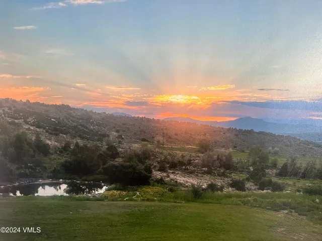 a view of mountain with lake view