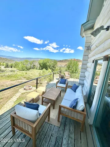 a view of a balcony with chairs