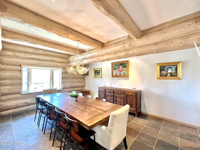 a view of a dining room with furniture and window