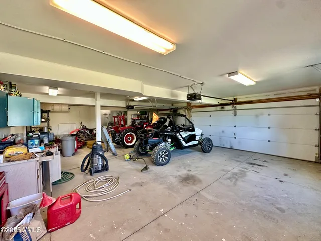 a view of a garage with parked cars