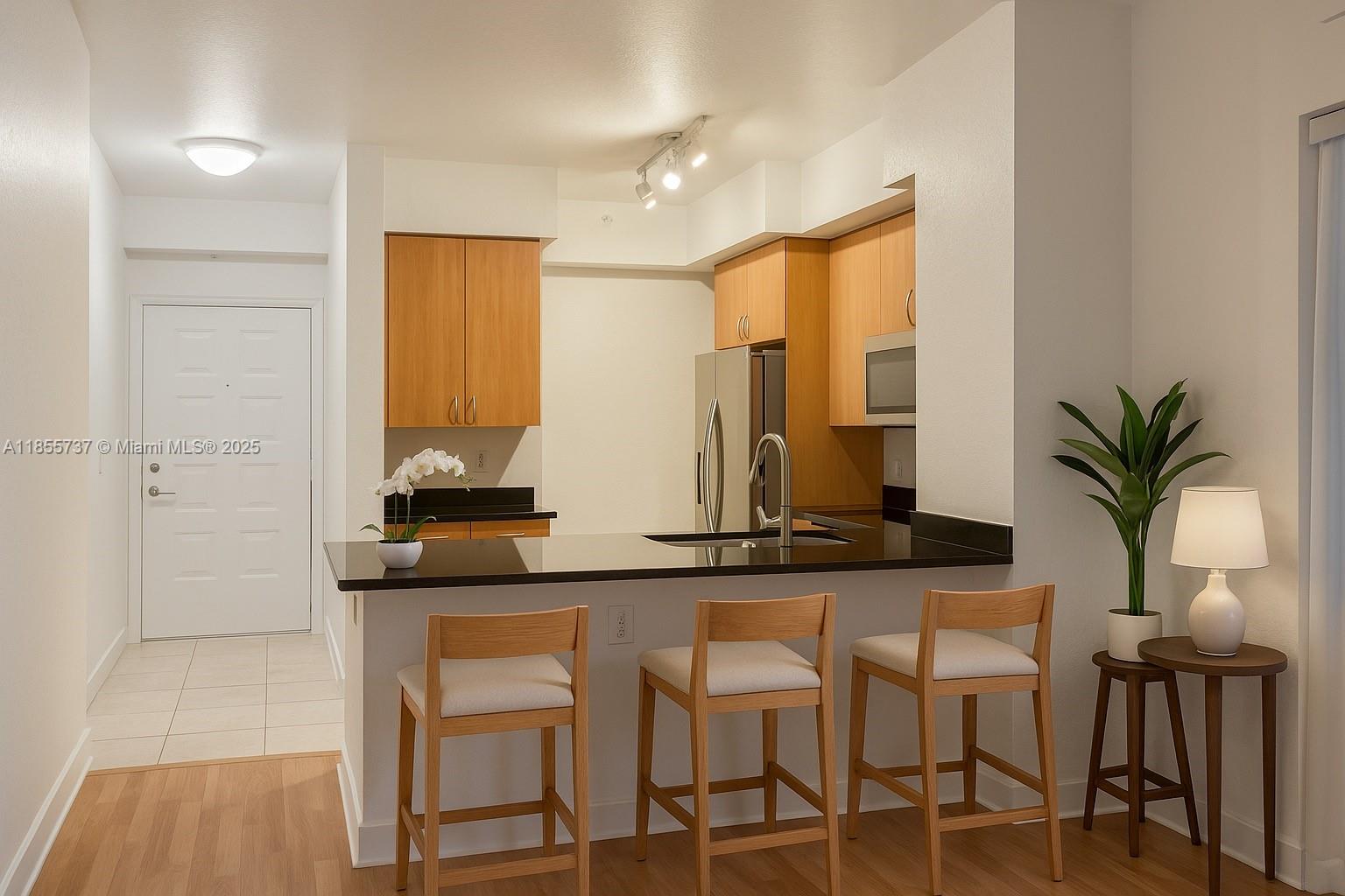 a kitchen with a table and chairs in it