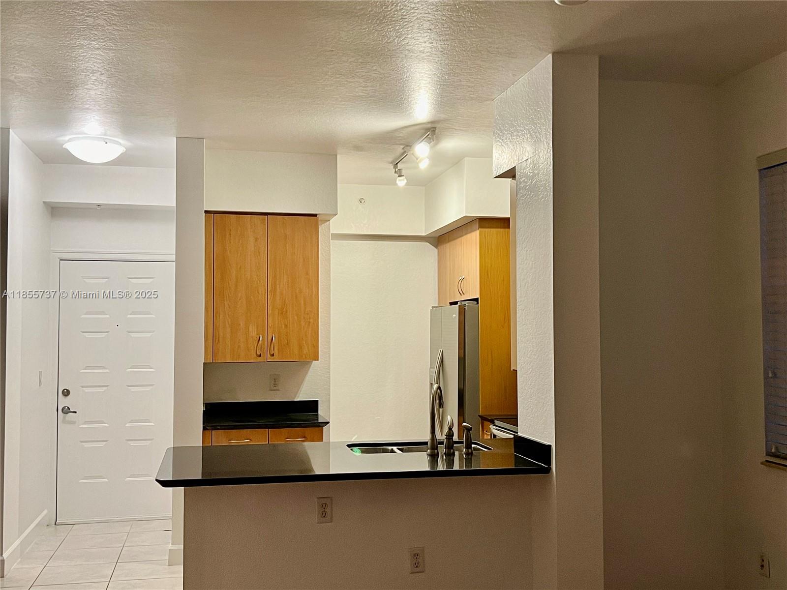 1830 Radius Drive, Unit 1301 Hollywood, FL 33020 - Photo 2 of 41 a bathroom with a shower