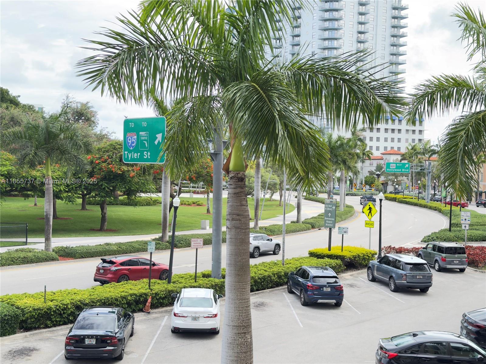 1830 Radius Drive, Unit 1301 Hollywood, FL 33020 - Photo 22 of 41 a view of a street with cars park